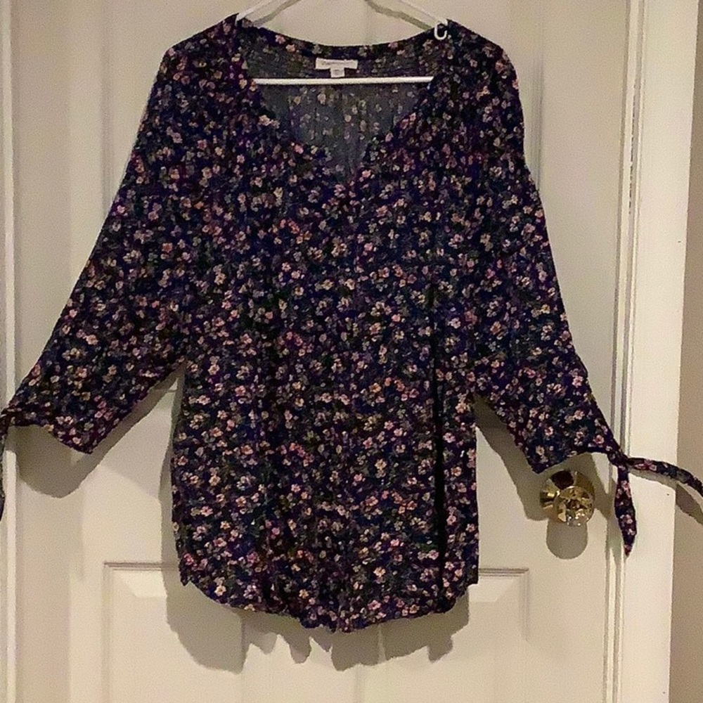 Navy blue floral print smocked blouse.